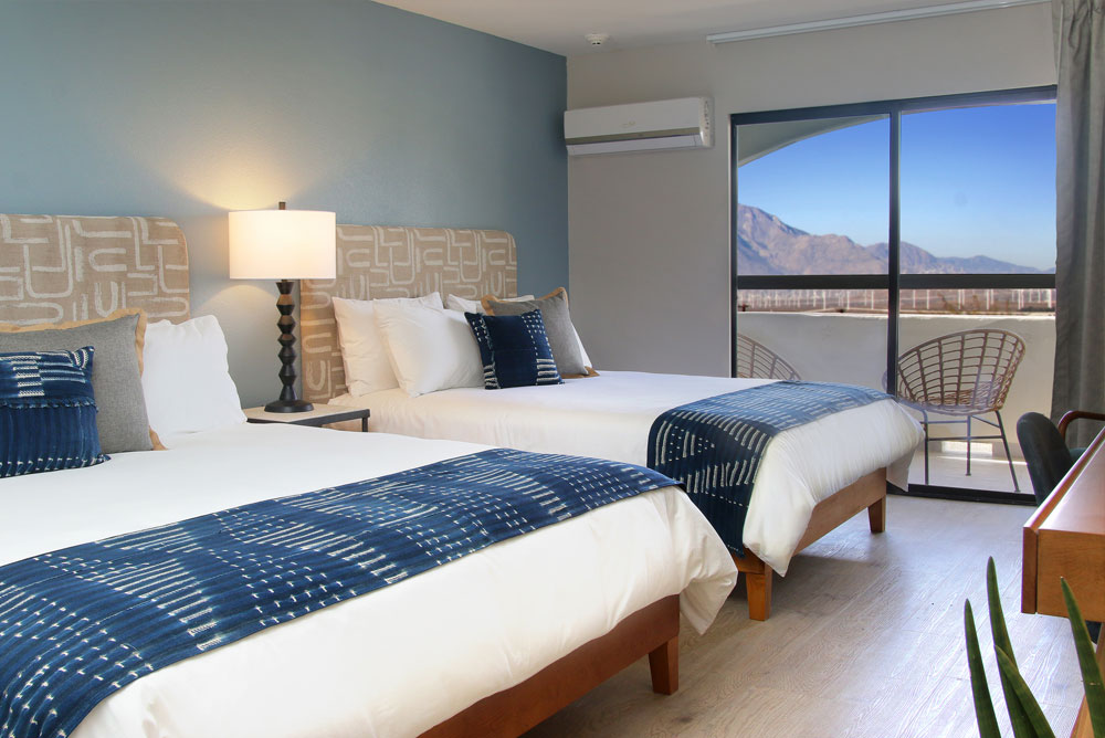 Western views of city lights framed by snow-capped Mt. San Gorgonio from your private balcony