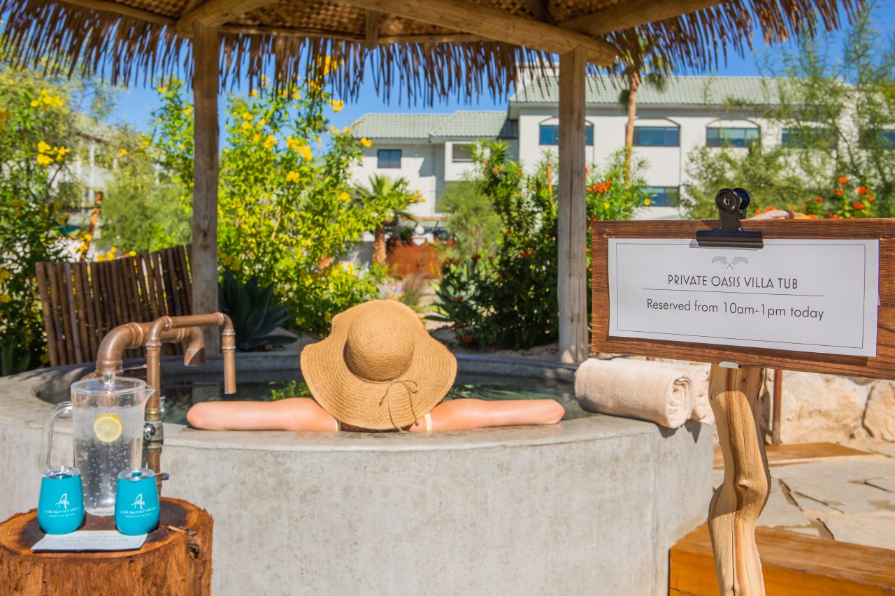 Private Villa Tub Rentals Available: Woman soaking in a reserved villa tub