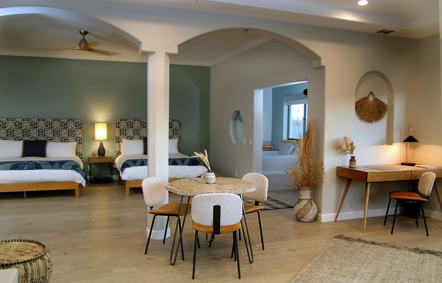 Santa Rosa suite with 2 beds, desk, bistro table and chairs, and in-room spa suite