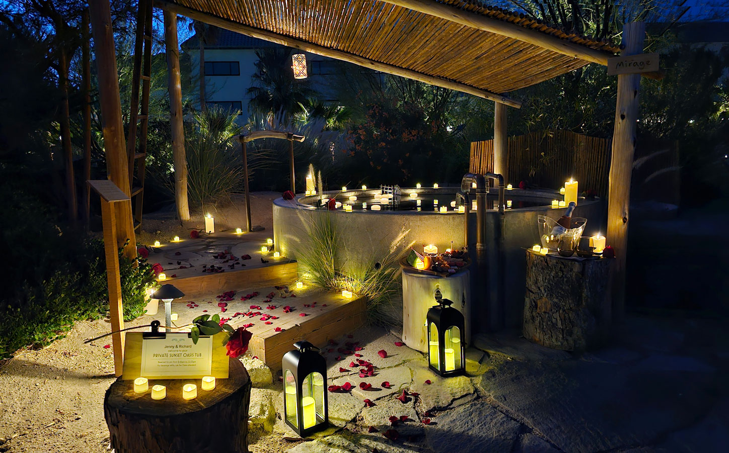 Romantic oasis tub surrounded by candles and rose petals